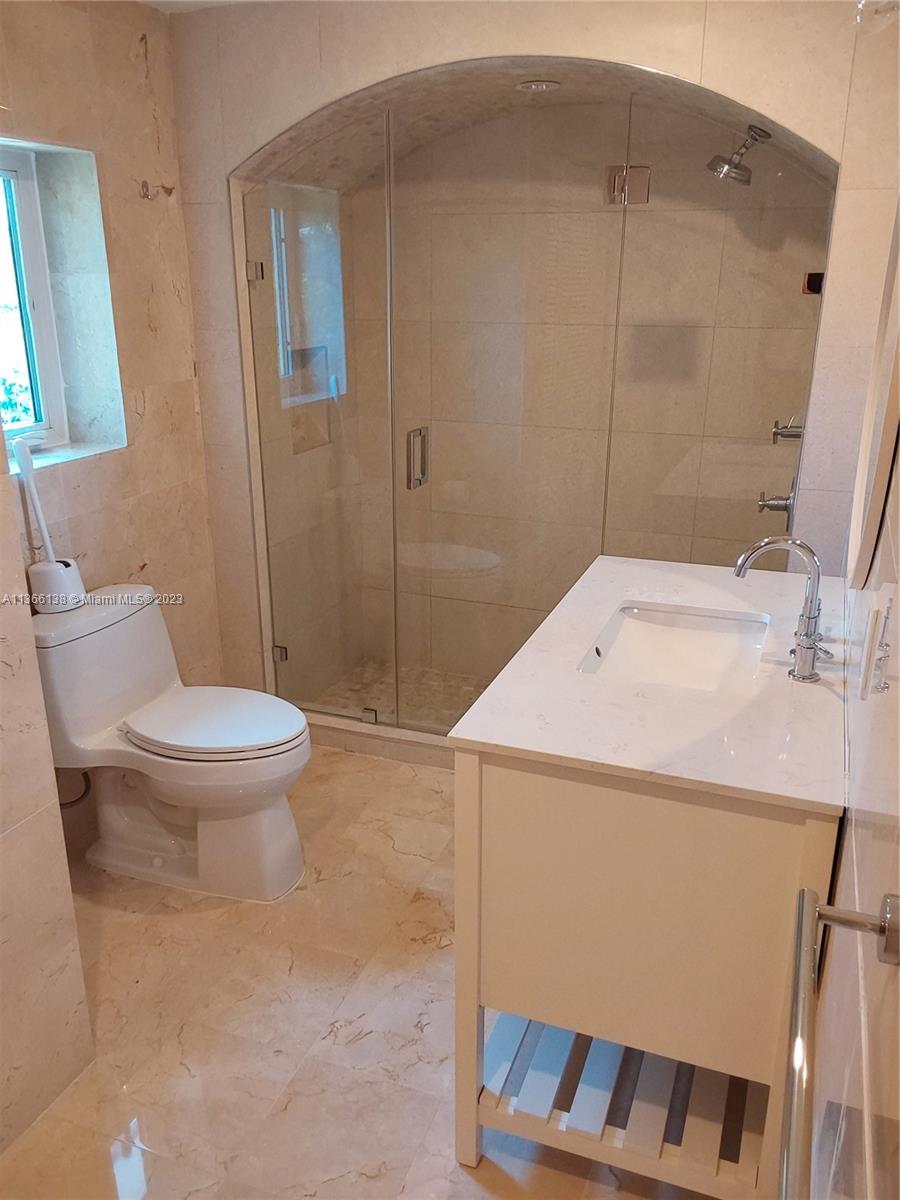 La Gorce Miami Beach, FL 33140 - Photo 10 of 33 a bathroom with a sink a toilet and shower