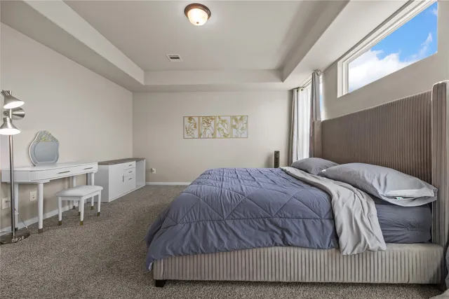 a bedroom with a bed and window