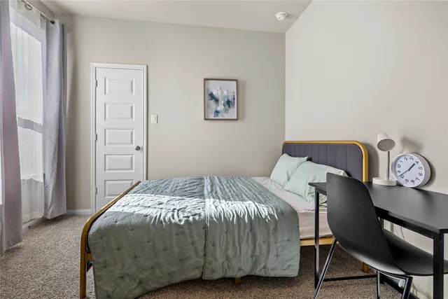 a bathroom with a sink a toilet a shower and a mirror