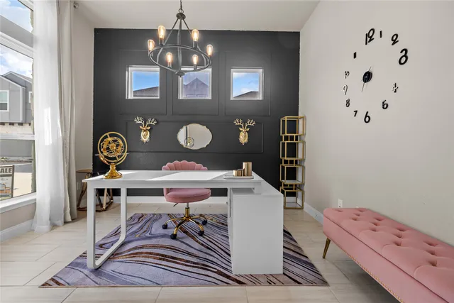 a bed room with a bed and a chandelier