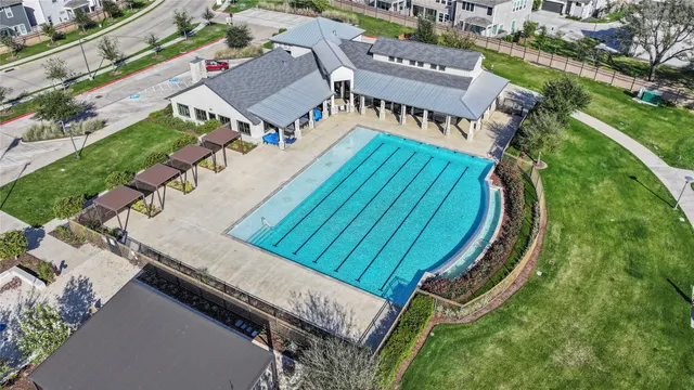 an aerial view of a house having swimming pool