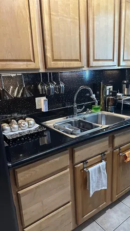 a kitchen with a sink and cabinets