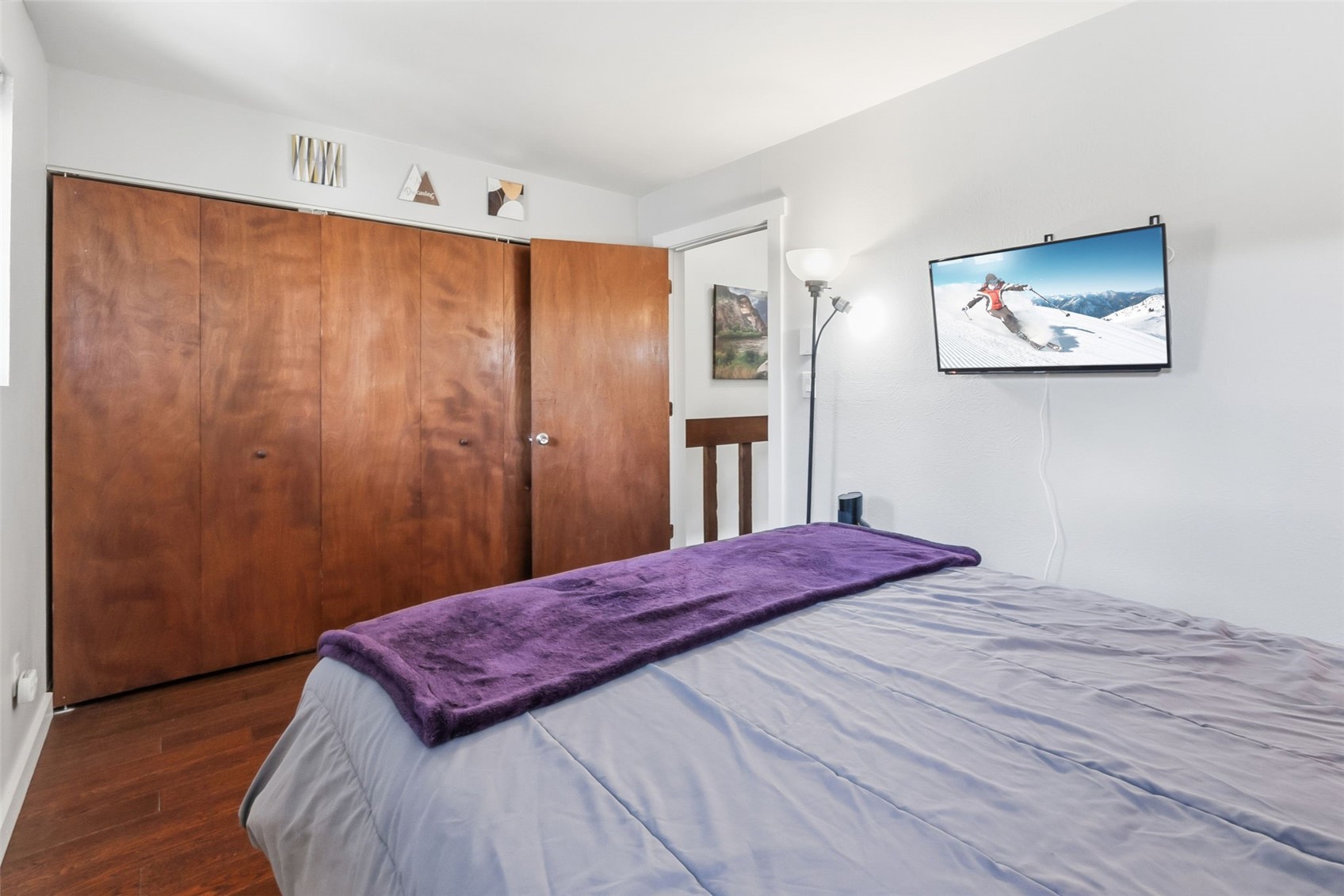 6920 Ryan Gulch Road, Unit 6920 Silverthorne, CO 80498 - Photo 24 of 48 a bedroom with a bed and a dresser