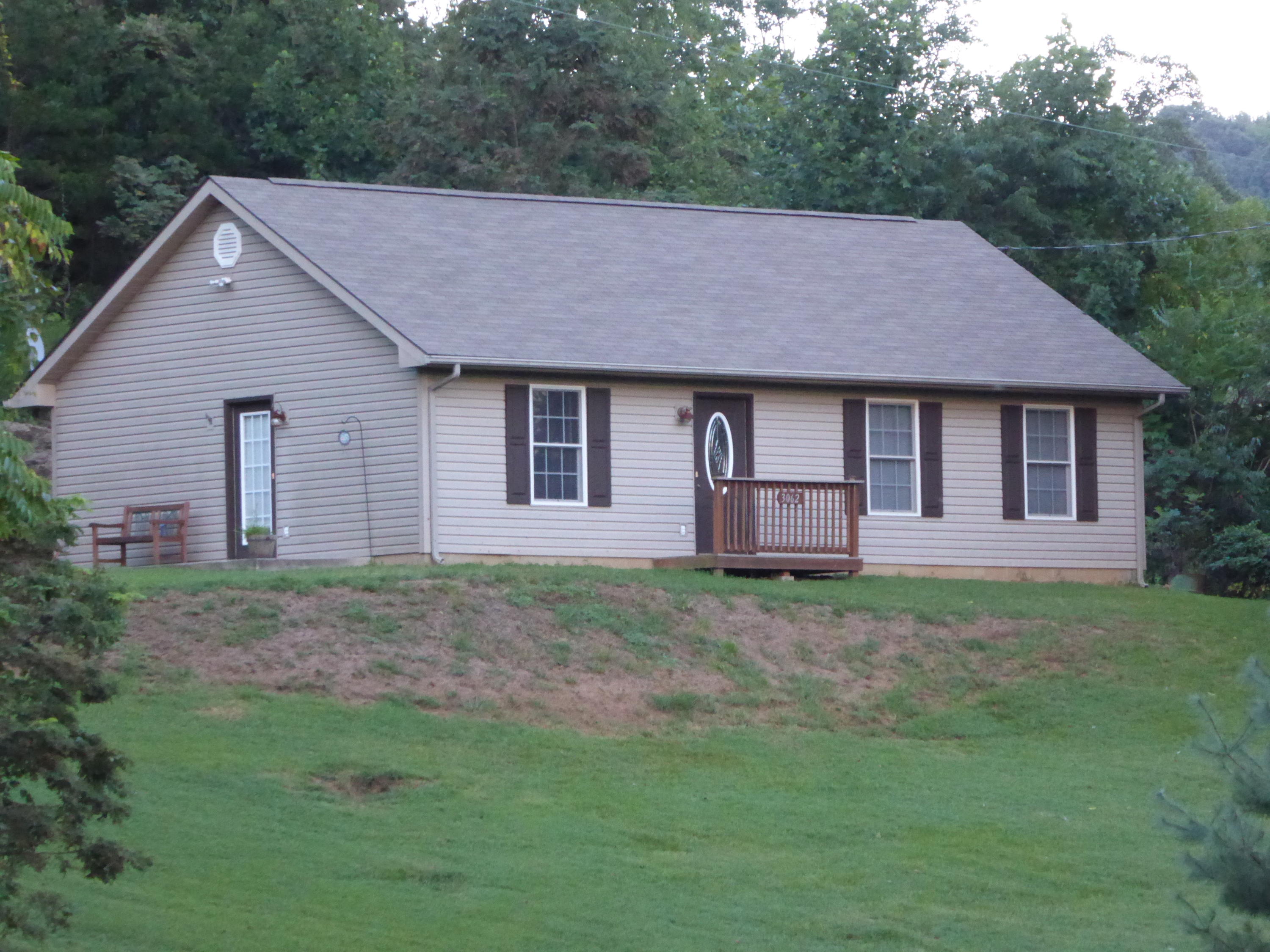 3062 Saunders Road Vinton, VA 24179 - Photo 1 of 40 a aerial view of a house next to a yard with large trees