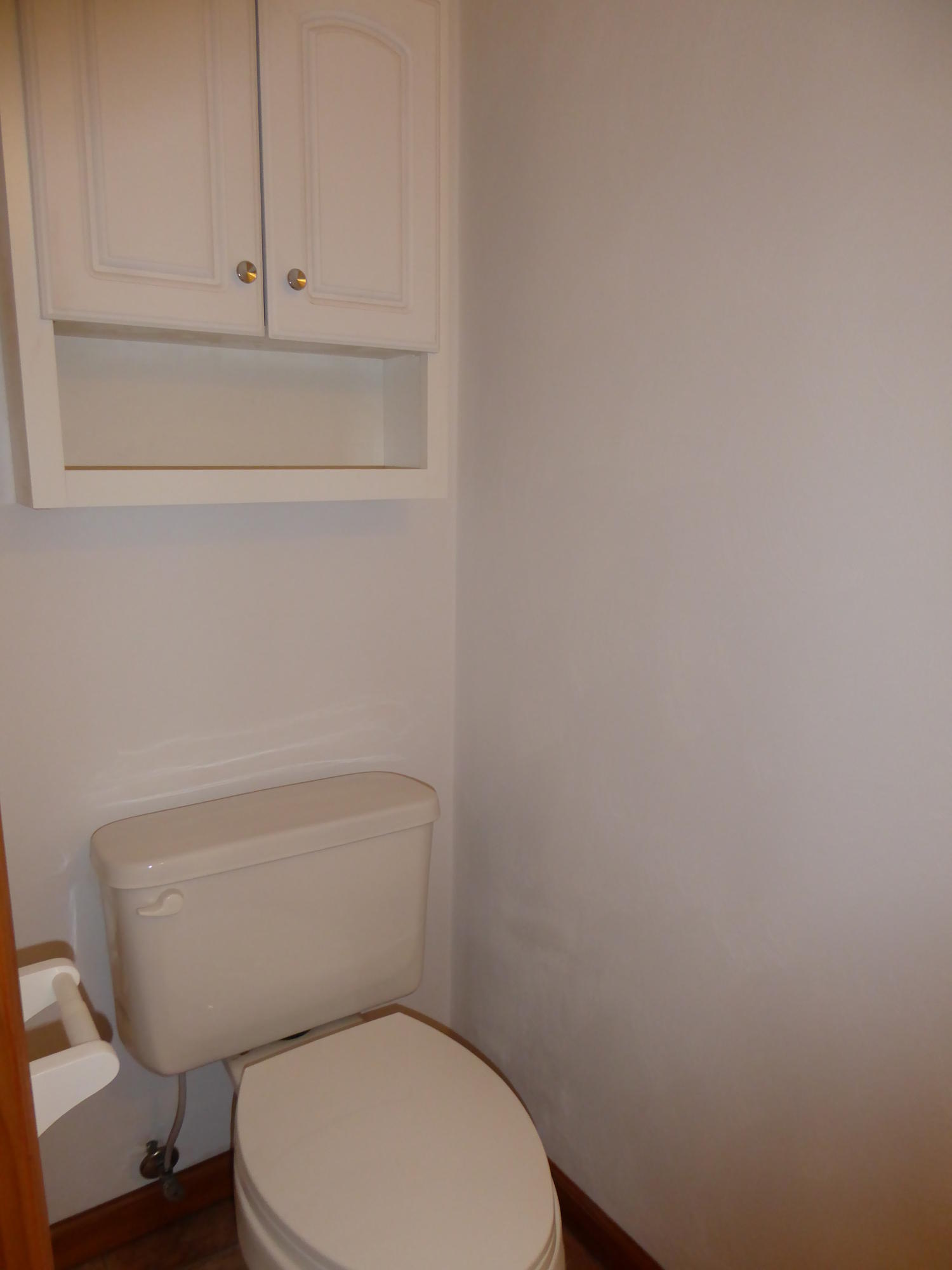 3062 Saunders Road Vinton, VA 24179 - Photo 15 of 40 a white toilet sitting next to a white cabinet