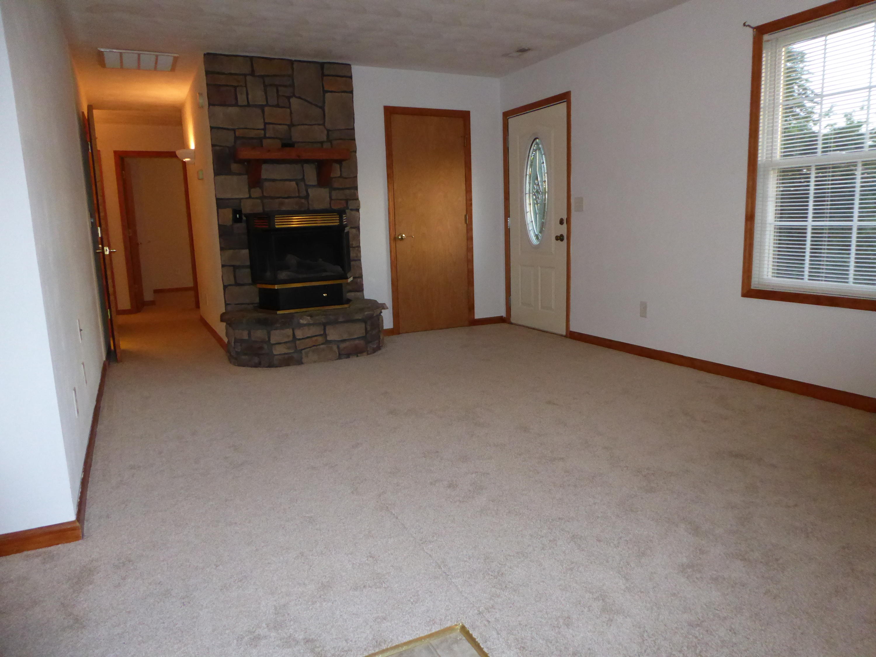 3062 Saunders Road Vinton, VA 24179 - Photo 3 of 40 an empty room with fire place and windows