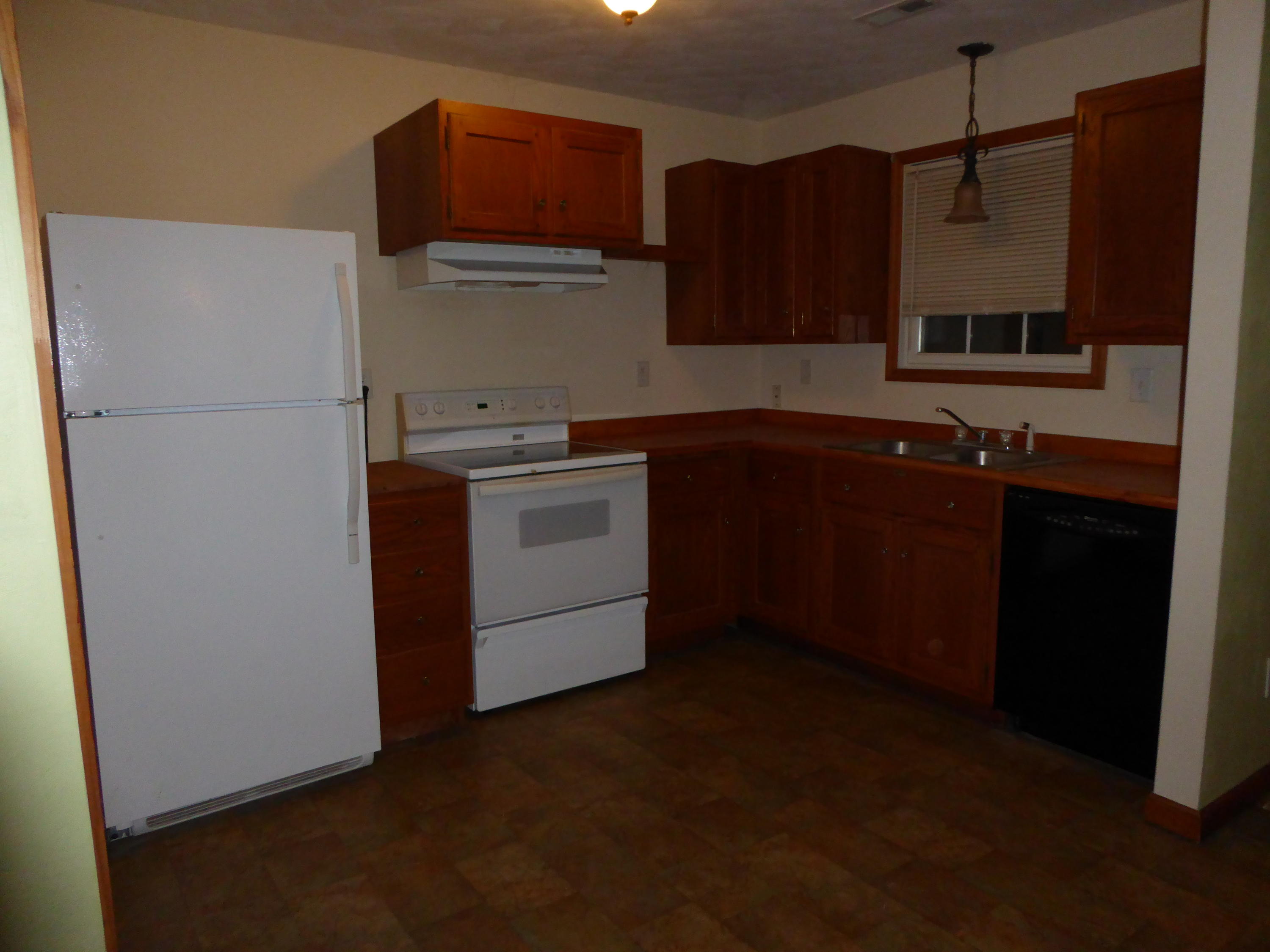 3062 Saunders Road Vinton, VA 24179 - Photo 32 of 40 a kitchen with a sink and a refrigerator