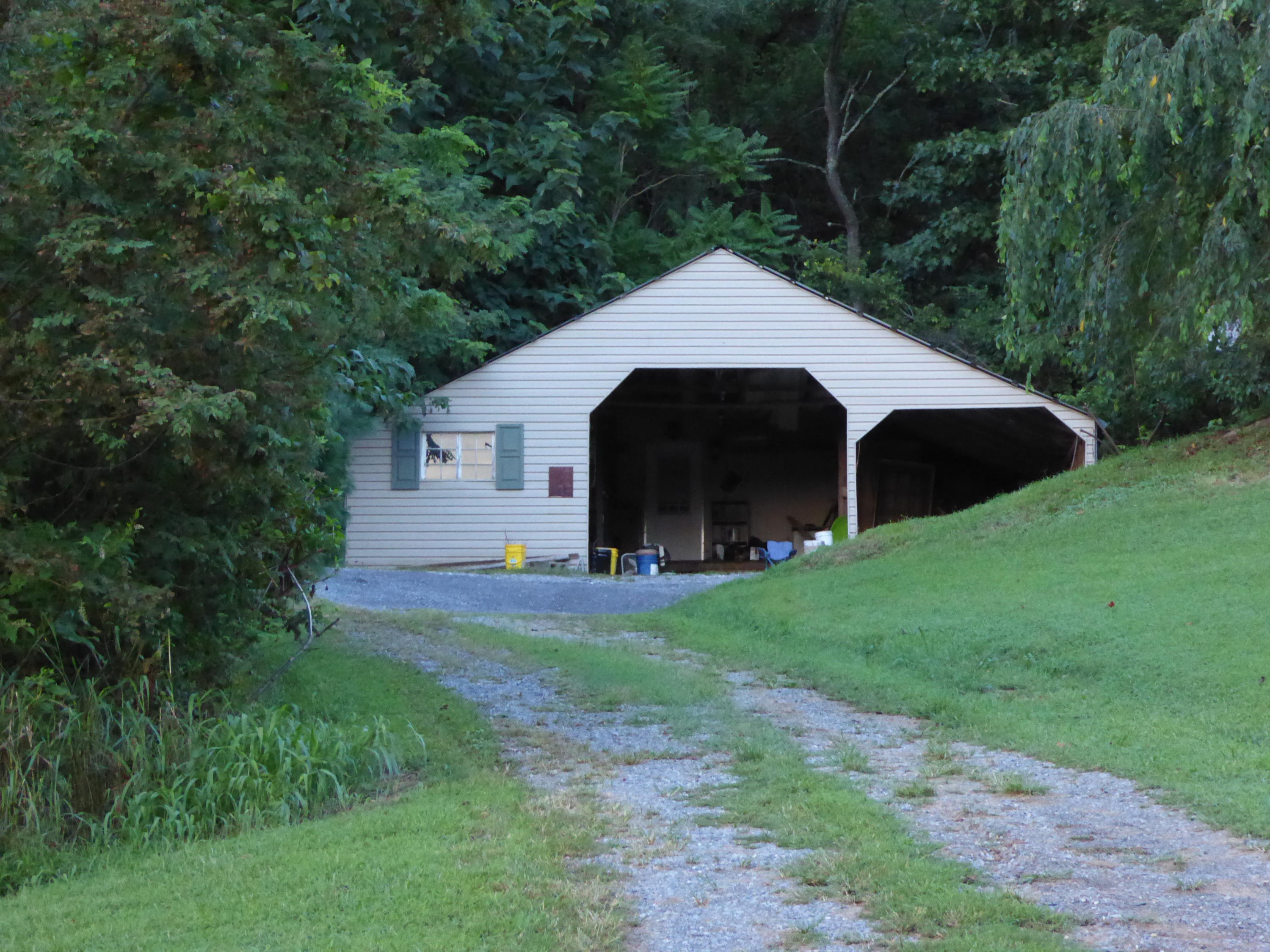 3062 Saunders Road Vinton, VA 24179 - Photo 36 of 40 a view of an house with backyard space and garden
