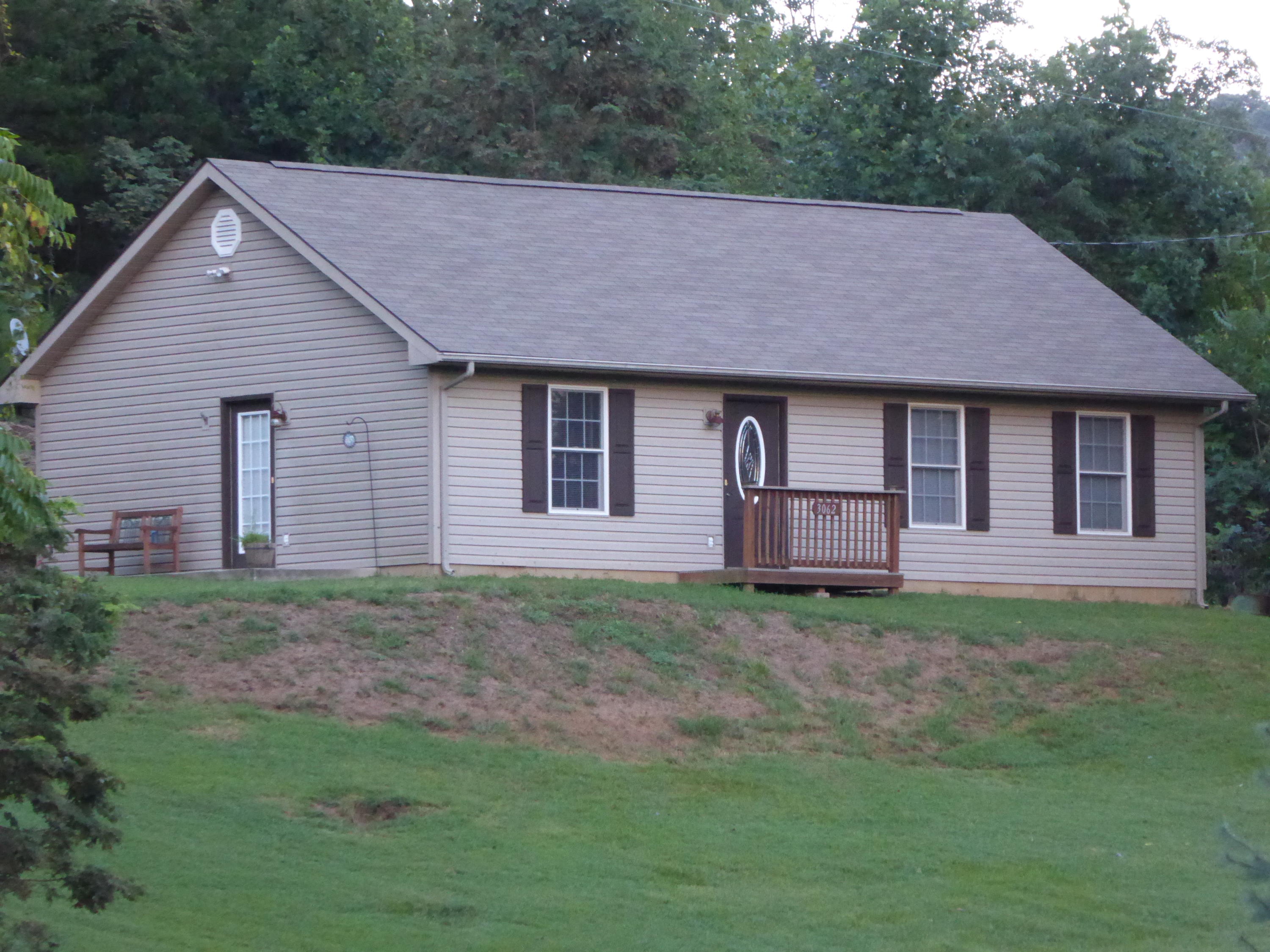 3062 Saunders Road Vinton, VA 24179 - Photo 40 of 40 a aerial view of a house next to a yard and large trees