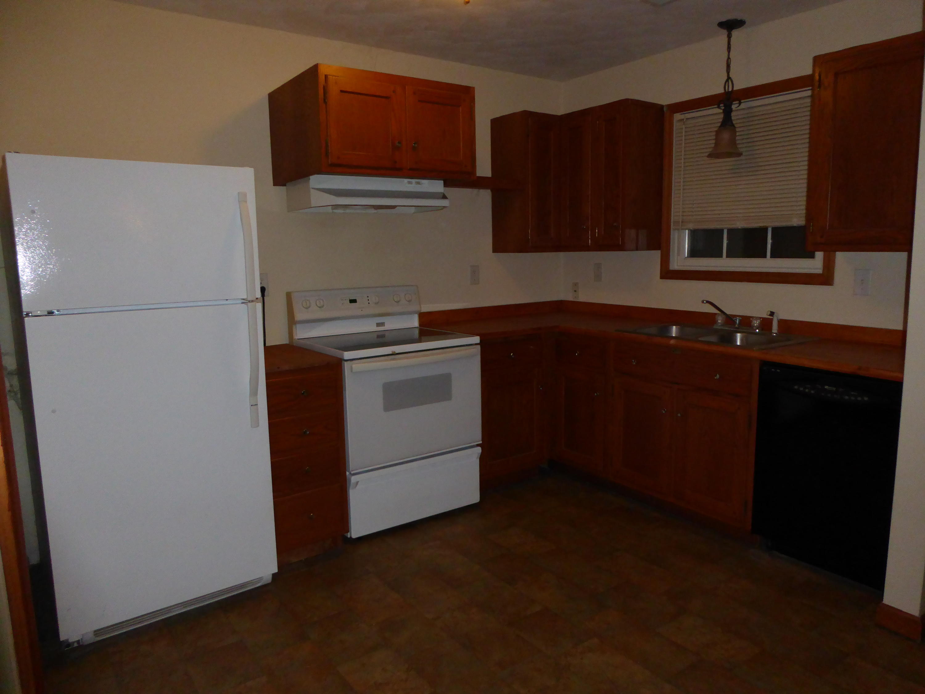 3062 Saunders Road Vinton, VA 24179 - Photo 6 of 40 a kitchen with a sink and a refrigerator