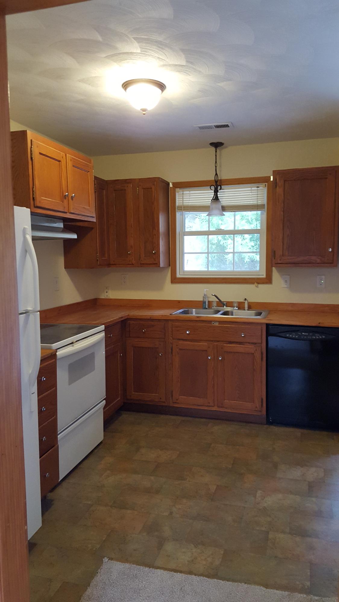 3062 Saunders Road Vinton, VA 24179 - Photo 10 of 40 a kitchen with stainless steel appliances granite countertop a stove a sink dishwasher and a refrigerator