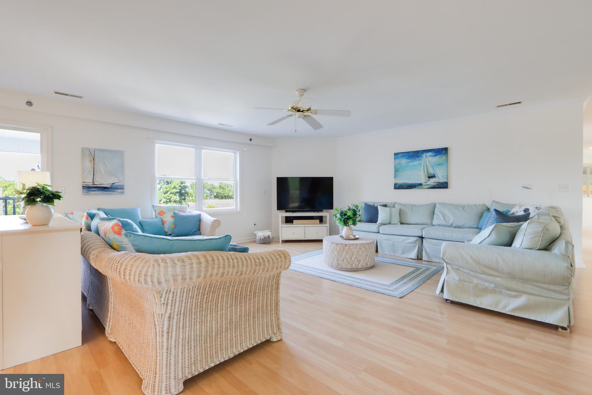 24 Brooklyn Avenue, Unit E Rehoboth Beach, DE 19971 - Photo 13 of 74 a living room with furniture and a flat screen tv