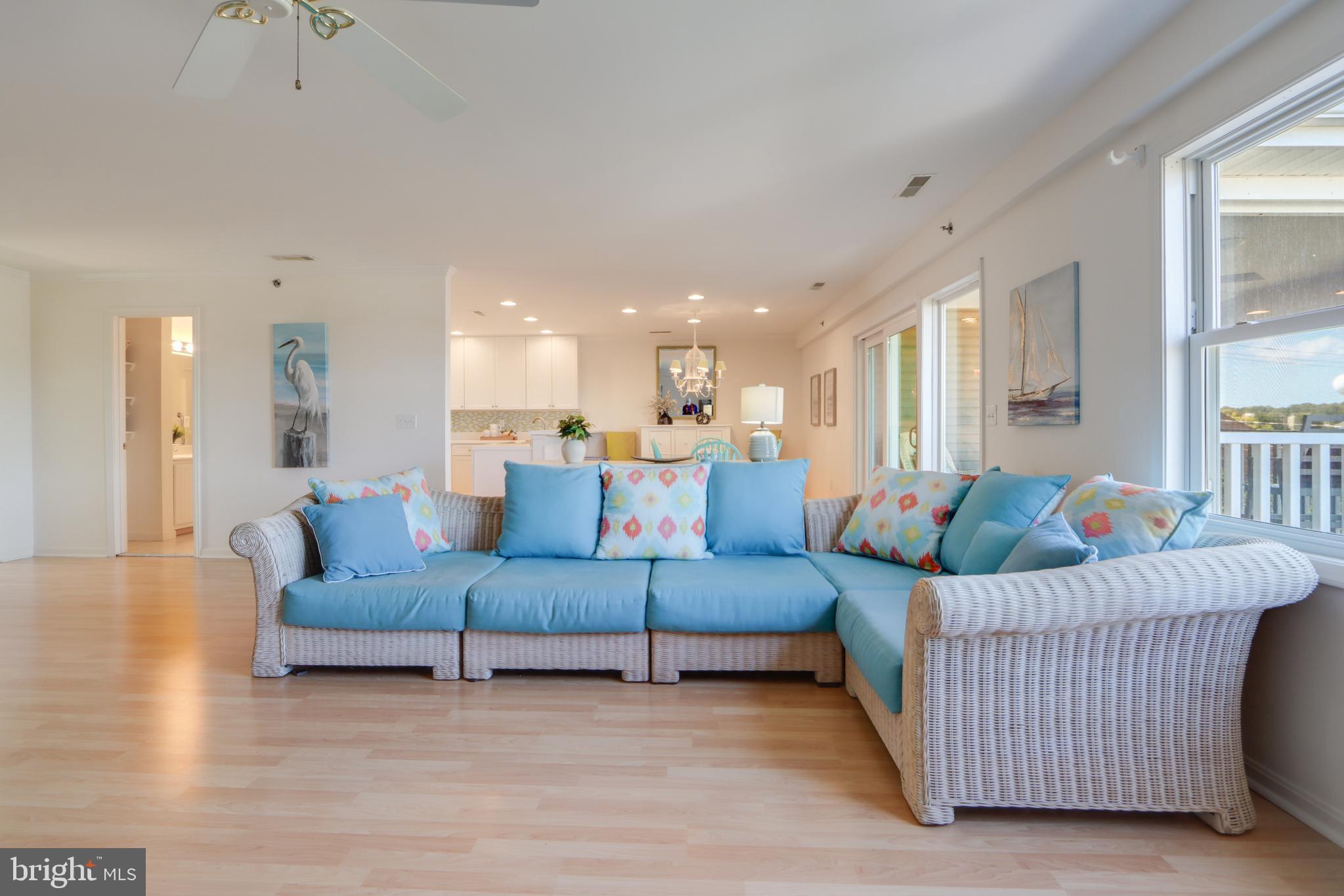 24 Brooklyn Avenue, Unit E Rehoboth Beach, DE 19971 - Photo 16 of 74 a living room with furniture and a large window