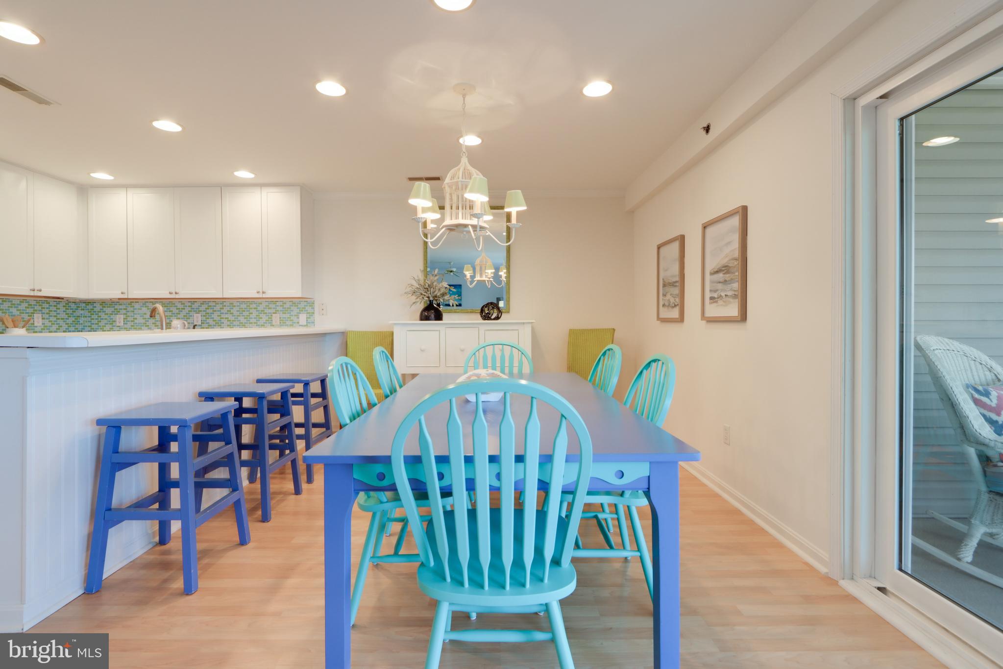 24 Brooklyn Avenue, Unit E Rehoboth Beach, DE 19971 - Photo 19 of 74 a view of a dining room with furniture and wooden floor