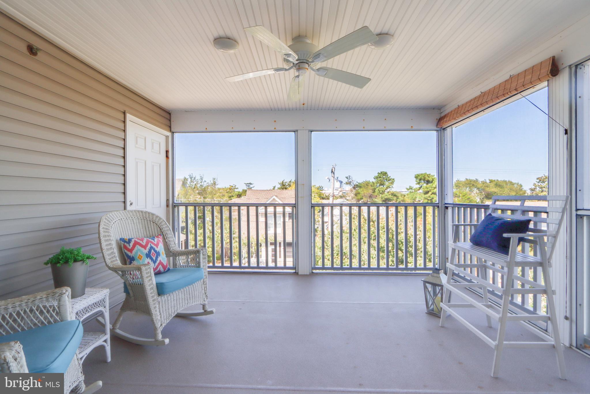 24 Brooklyn Avenue, Unit E Rehoboth Beach, DE 19971 - Photo 26 of 74 a view of a porch with furniture