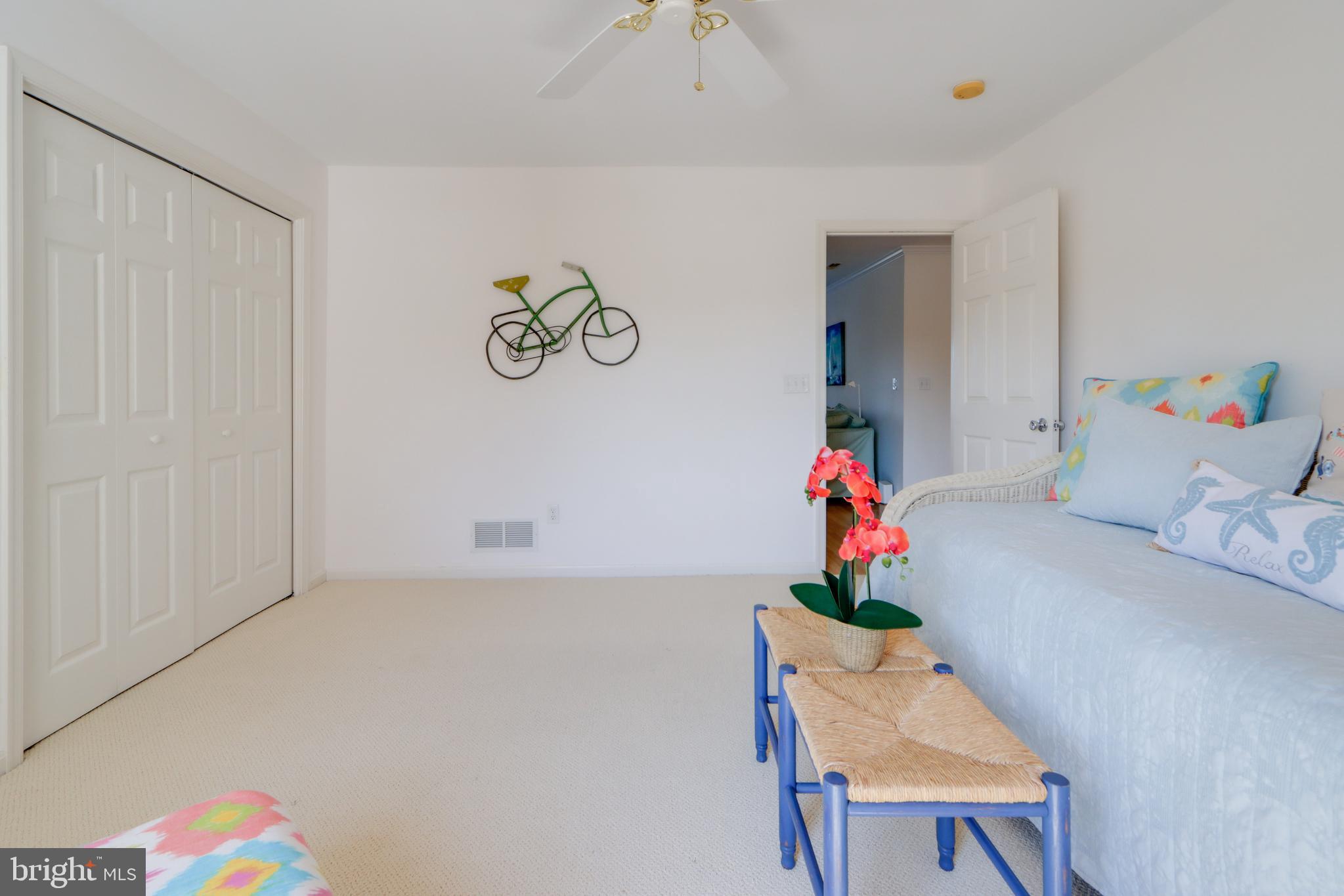 24 Brooklyn Avenue, Unit E Rehoboth Beach, DE 19971 - Photo 35 of 74 a room with furniture and a potted plant