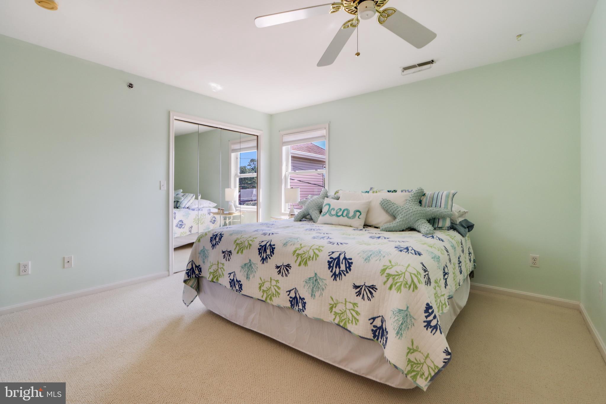 24 Brooklyn Avenue, Unit E Rehoboth Beach, DE 19971 - Photo 58 of 74 a bedroom with a bed and window