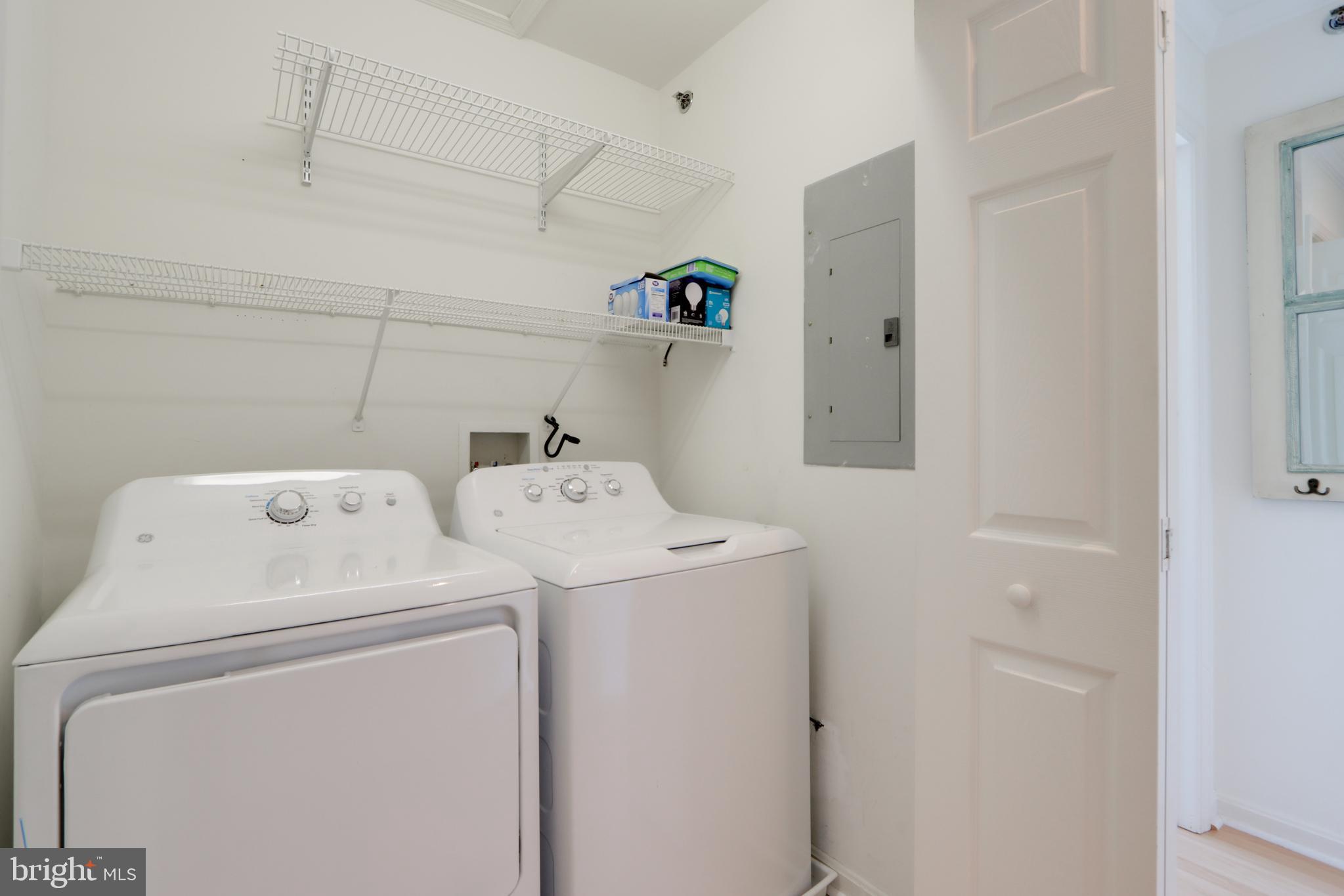 24 Brooklyn Avenue, Unit E Rehoboth Beach, DE 19971 - Photo 60 of 74 a utility room with dryer and washer