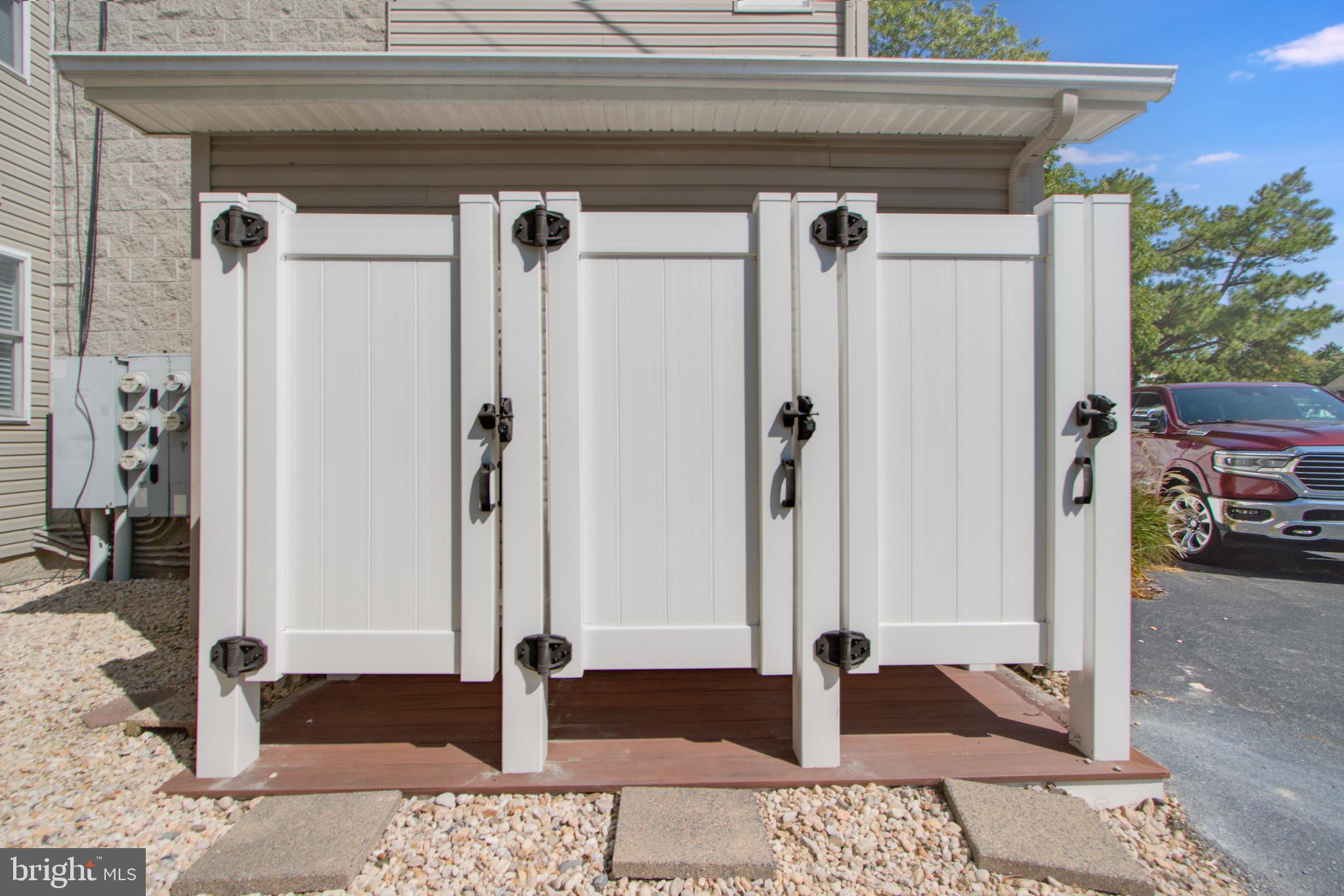 24 Brooklyn Avenue, Unit E Rehoboth Beach, DE 19971 - Photo 65 of 74 a view of a wooden door and a window