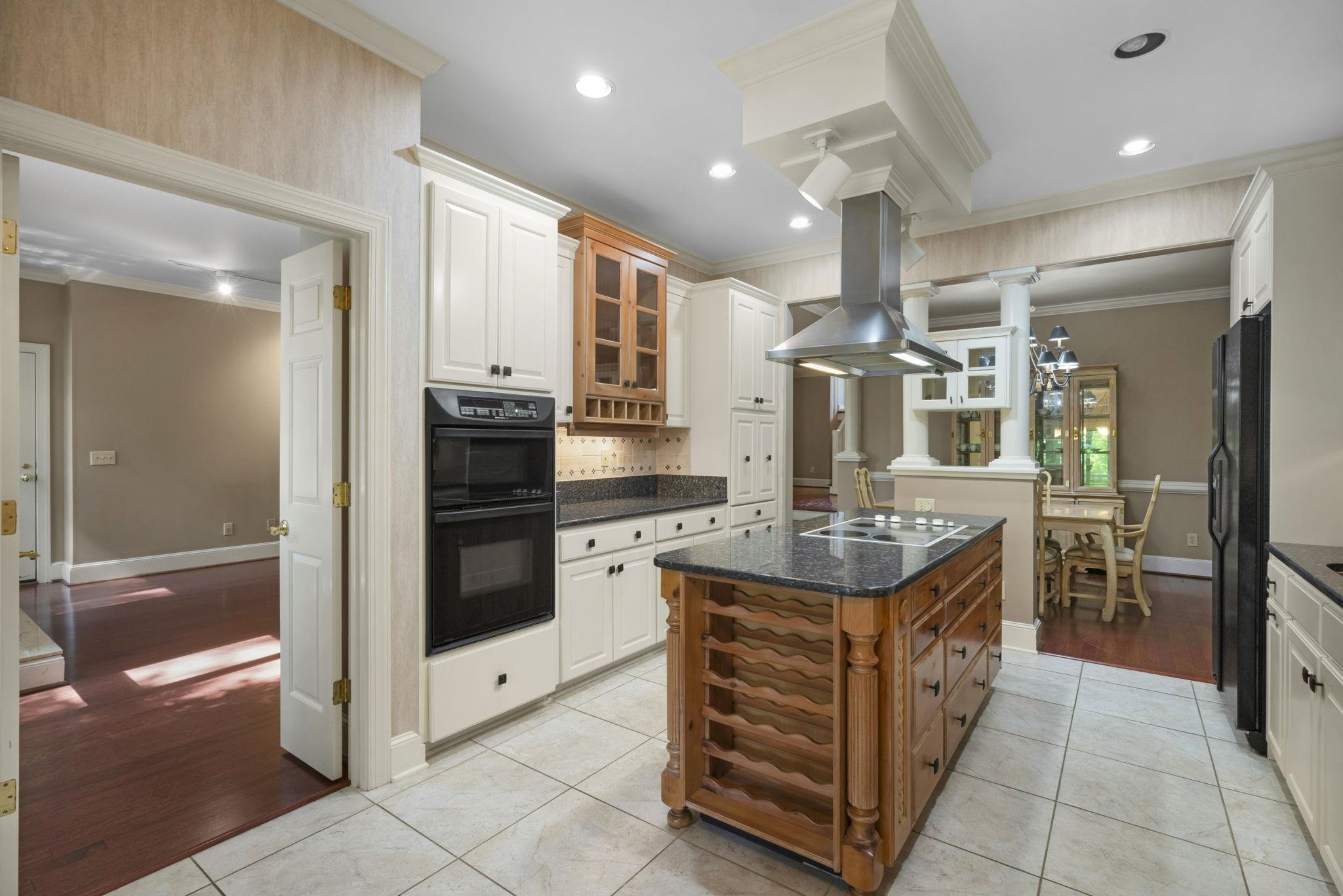 7500 Dartford Court, Unit 102 Raleigh, NC 27615 - Photo 11 of 36 a kitchen with stainless steel appliances granite countertop a stove and a refrigerator