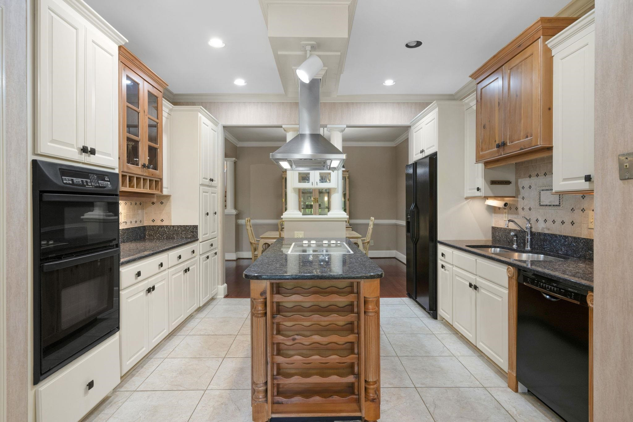 7500 Dartford Court, Unit 102 Raleigh, NC 27615 - Photo 14 of 36 a large kitchen with stainless steel appliances granite countertop a stove and a refrigerator