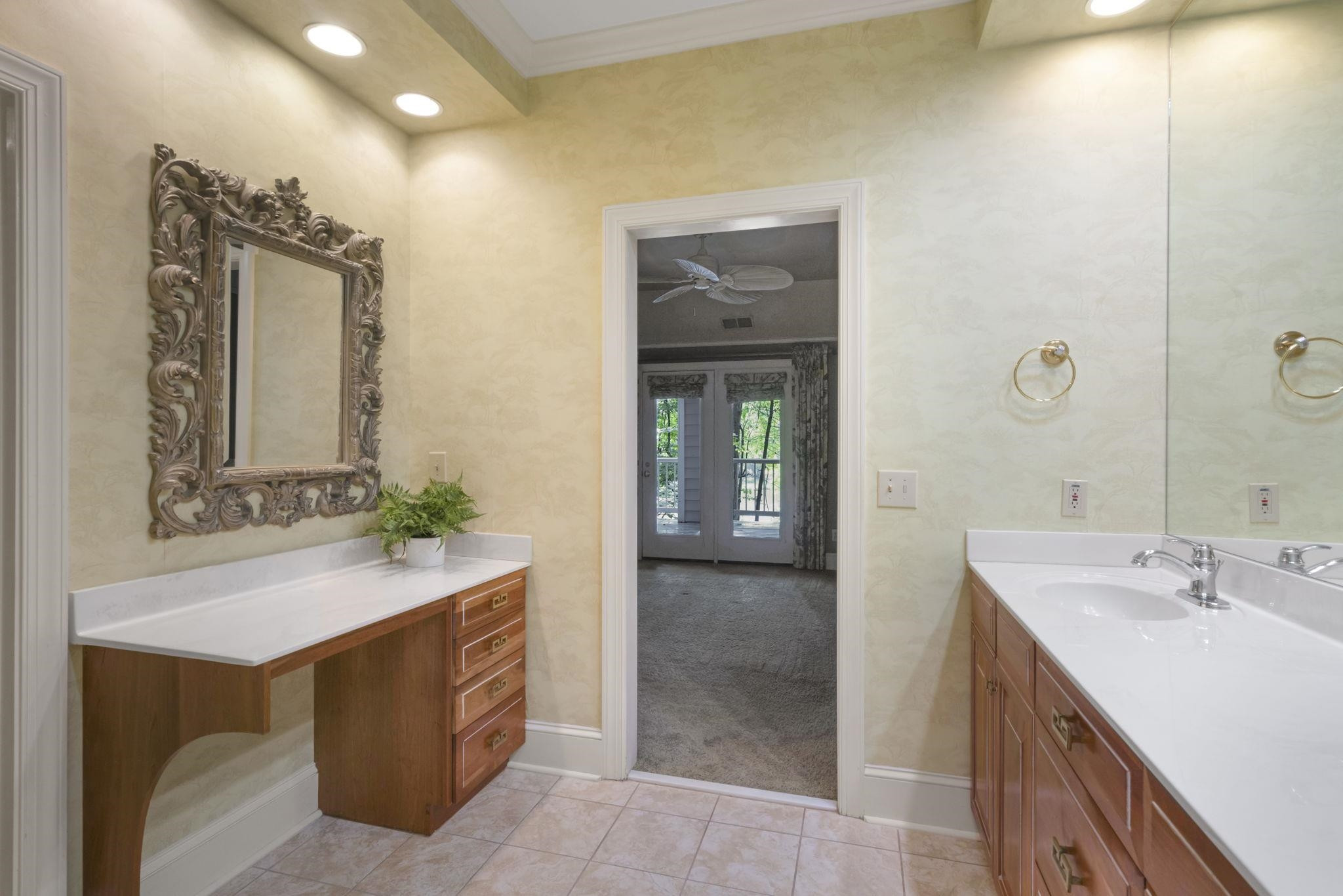 7500 Dartford Court, Unit 102 Raleigh, NC 27615 - Photo 21 of 36 a bathroom with a sink and a mirror