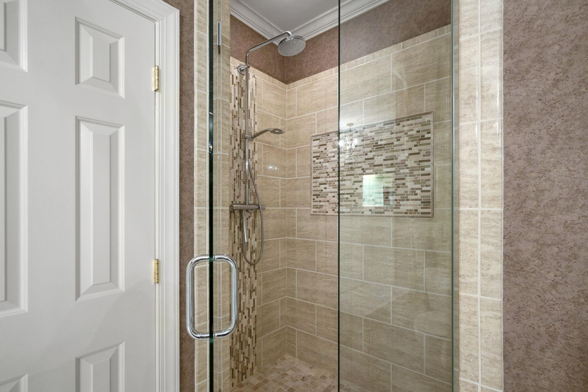 7500 Dartford Court, Unit 102 Raleigh, NC 27615 - Photo 23 of 36 a bathroom with a shower