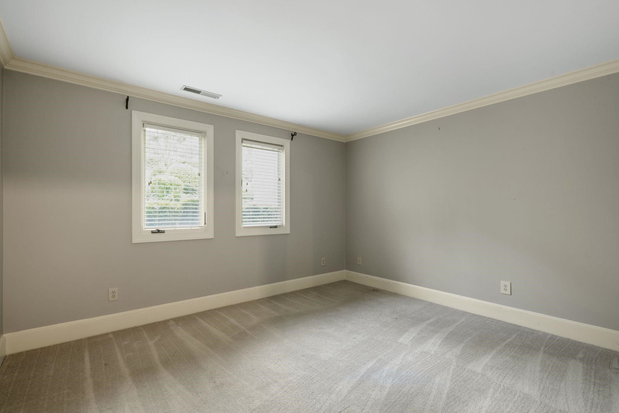 7500 Dartford Court, Unit 102 Raleigh, NC 27615 - Photo 26 of 36 an empty room with windows