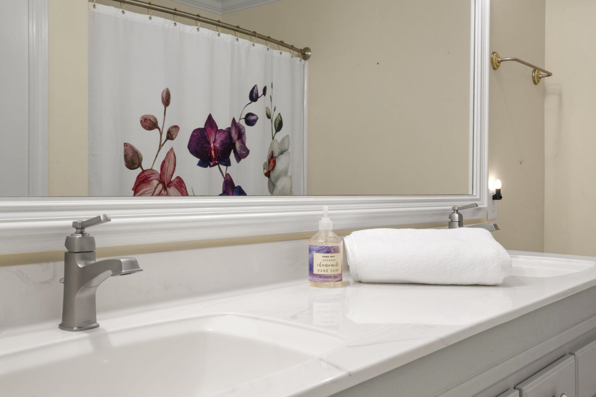 7500 Dartford Court, Unit 102 Raleigh, NC 27615 - Photo 28 of 36 a bathroom with a bathtub and sink