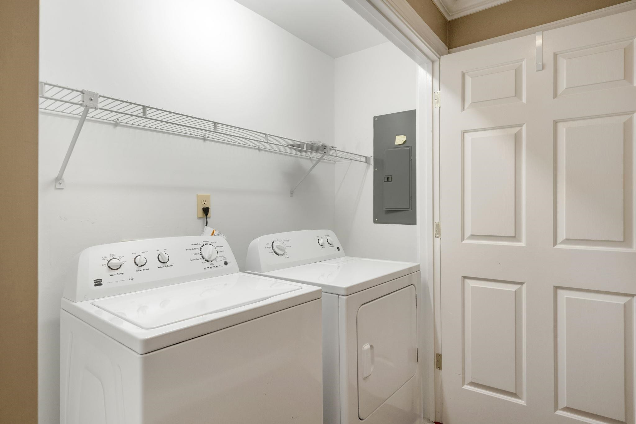 7500 Dartford Court, Unit 102 Raleigh, NC 27615 - Photo 29 of 36 a utility room with dryer and washer