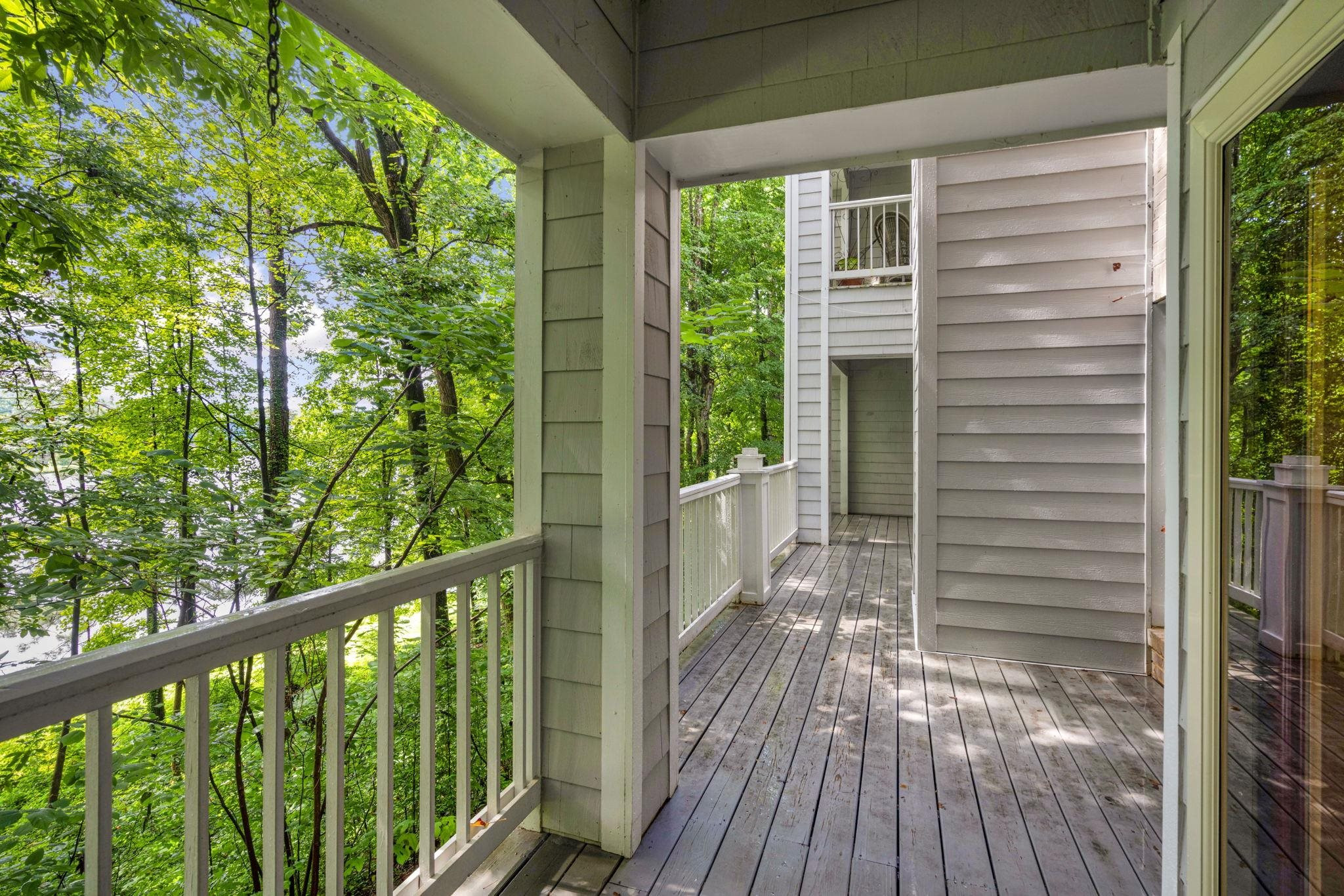 7500 Dartford Court, Unit 102 Raleigh, NC 27615 - Photo 31 of 36 a view of a balcony with wooden floor