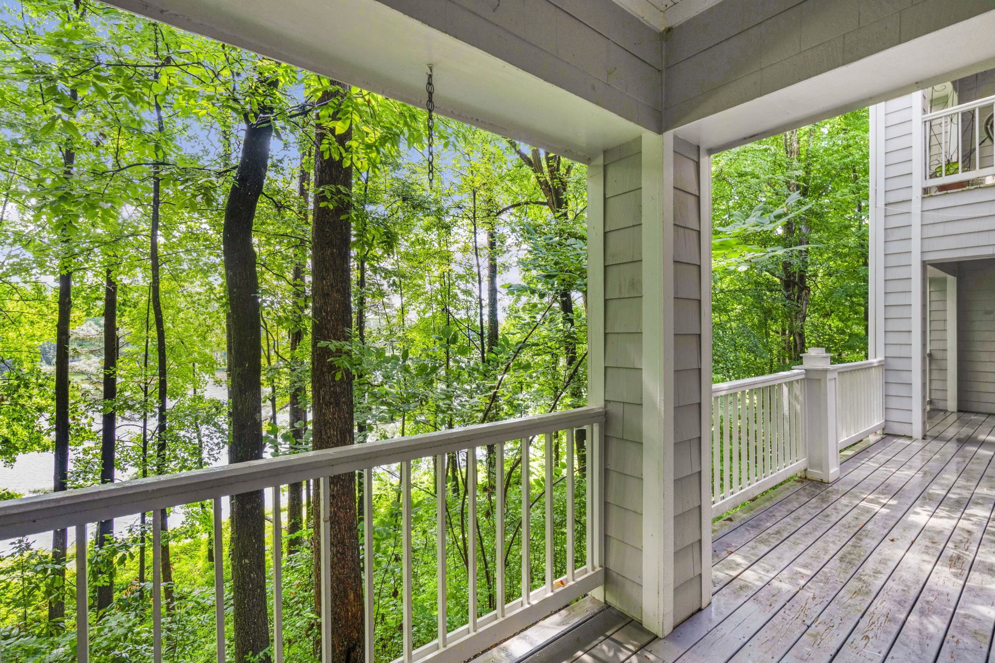 7500 Dartford Court, Unit 102 Raleigh, NC 27615 - Photo 32 of 36 a view of balcony with wooden floor