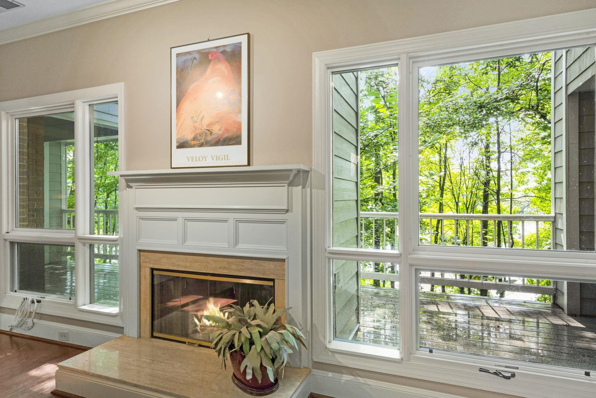 7500 Dartford Court, Unit 102 Raleigh, NC 27615 - Photo 6 of 36 a living room with a fireplace and a floor to ceiling window