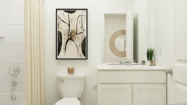 a bathroom with a sink vanity mirror and toilet