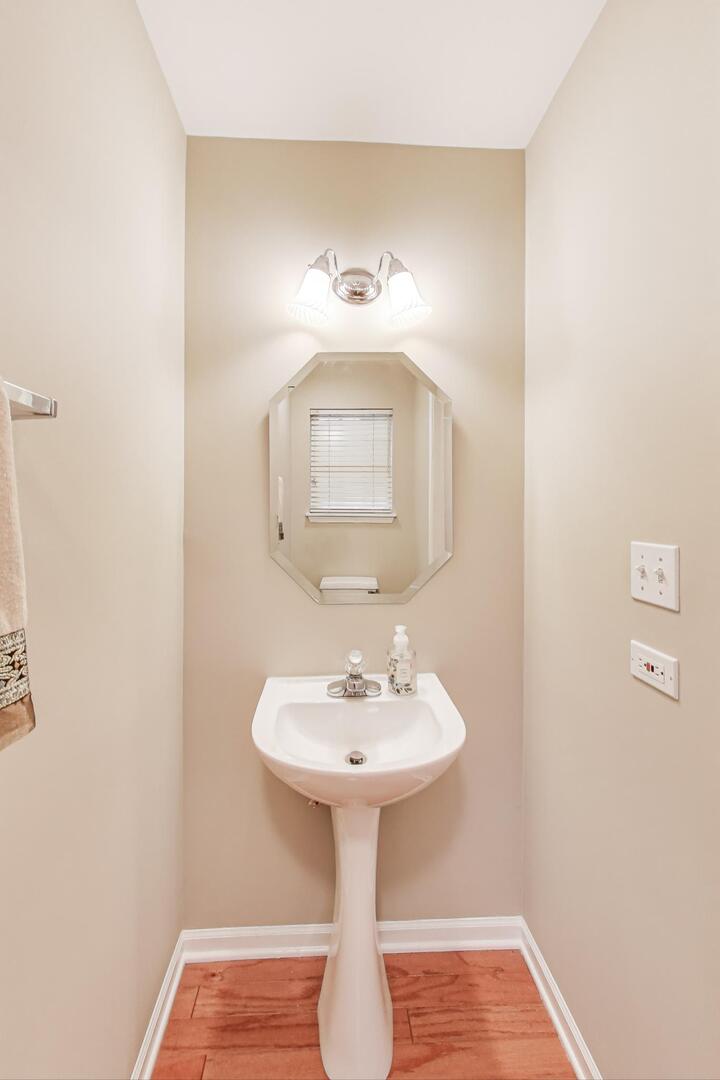 856 Old Checker Road Buffalo Grove, IL 60089 - Photo 13 of 31 a bathroom with a sink and a mirror