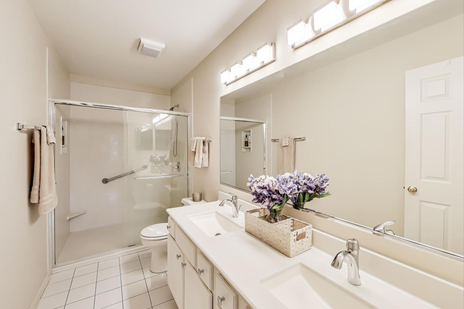 856 Old Checker Road Buffalo Grove, IL 60089 - Photo 20 of 31 a bathroom with a sink mirror toilet and shower