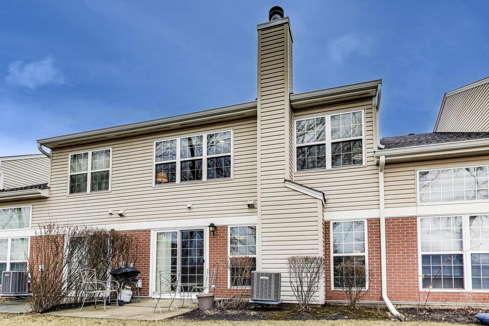 856 Old Checker Road Buffalo Grove, IL 60089 - Photo 26 of 31 a front view of a building with street