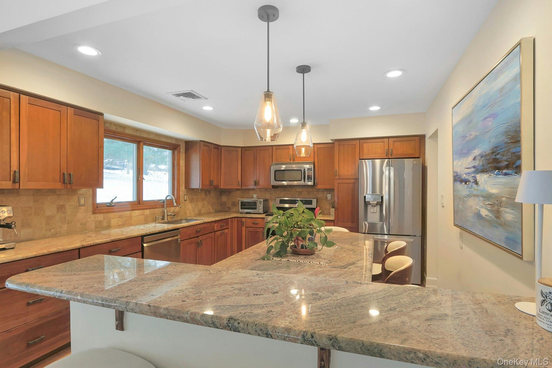 111 Wydendown Road Nyack, NY 10960 - Photo 14 of 46 a kitchen with stainless steel appliances granite countertop sink stove and refrigerator