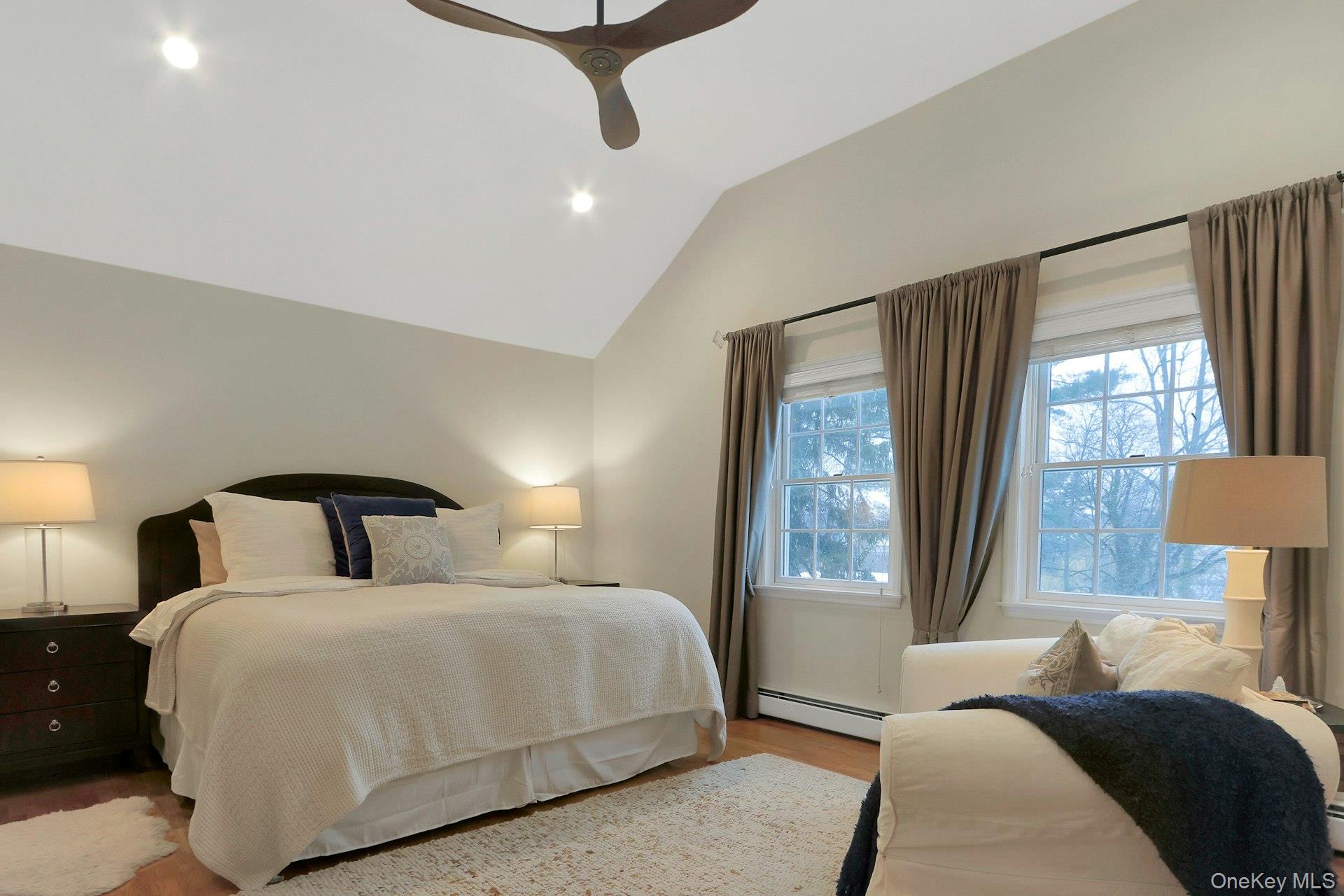 111 Wydendown Road Nyack, NY 10960 - Photo 19 of 46 a bedroom with a large bed and a lamp