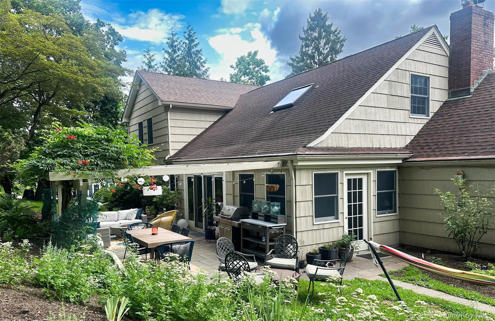 111 Wydendown Road Nyack, NY 10960 - Photo 2 of 46 a backyard of a house with yard barbeque oven and outdoor seating