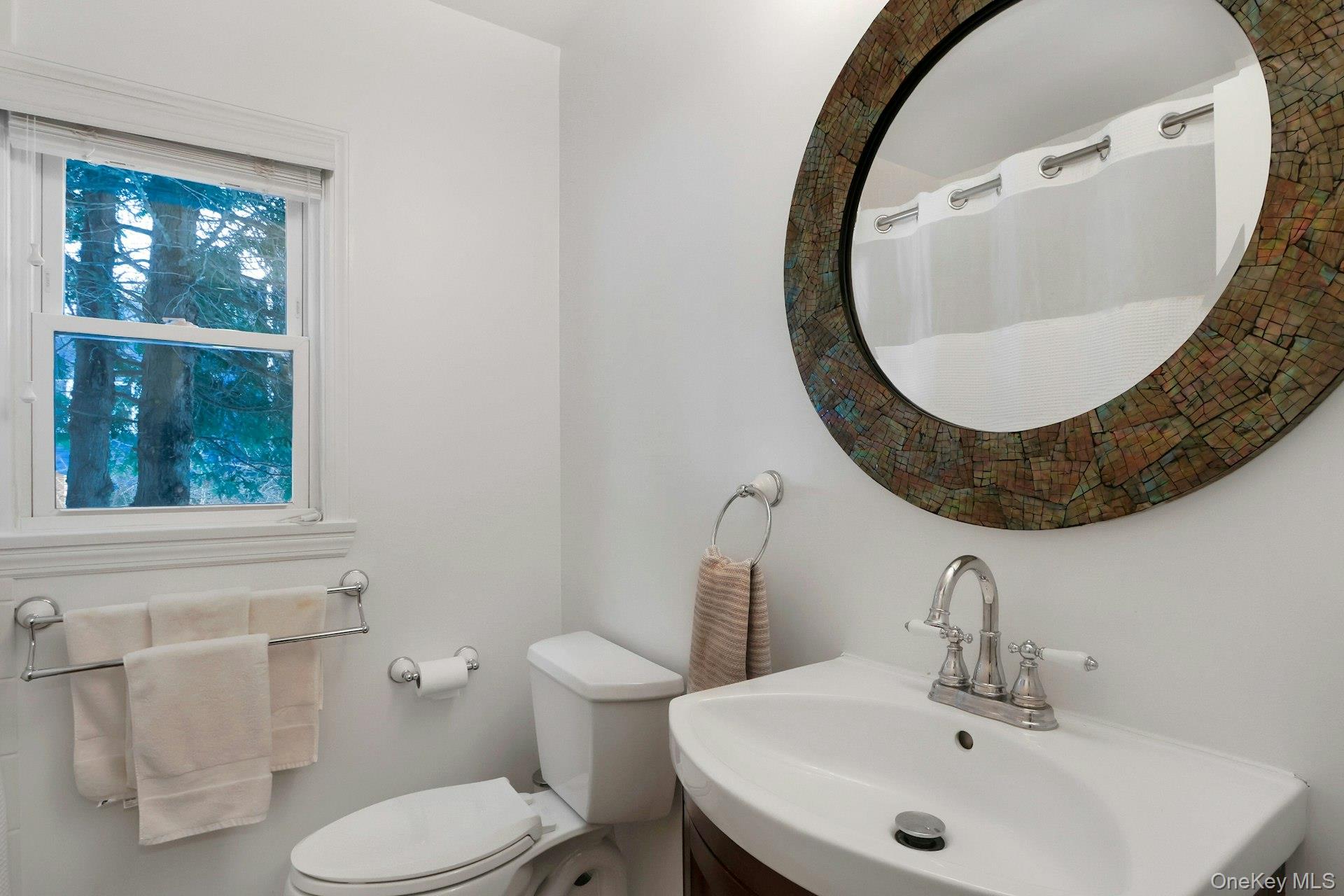 111 Wydendown Road Nyack, NY 10960 - Photo 32 of 46 a bathroom with a sink and mirror
