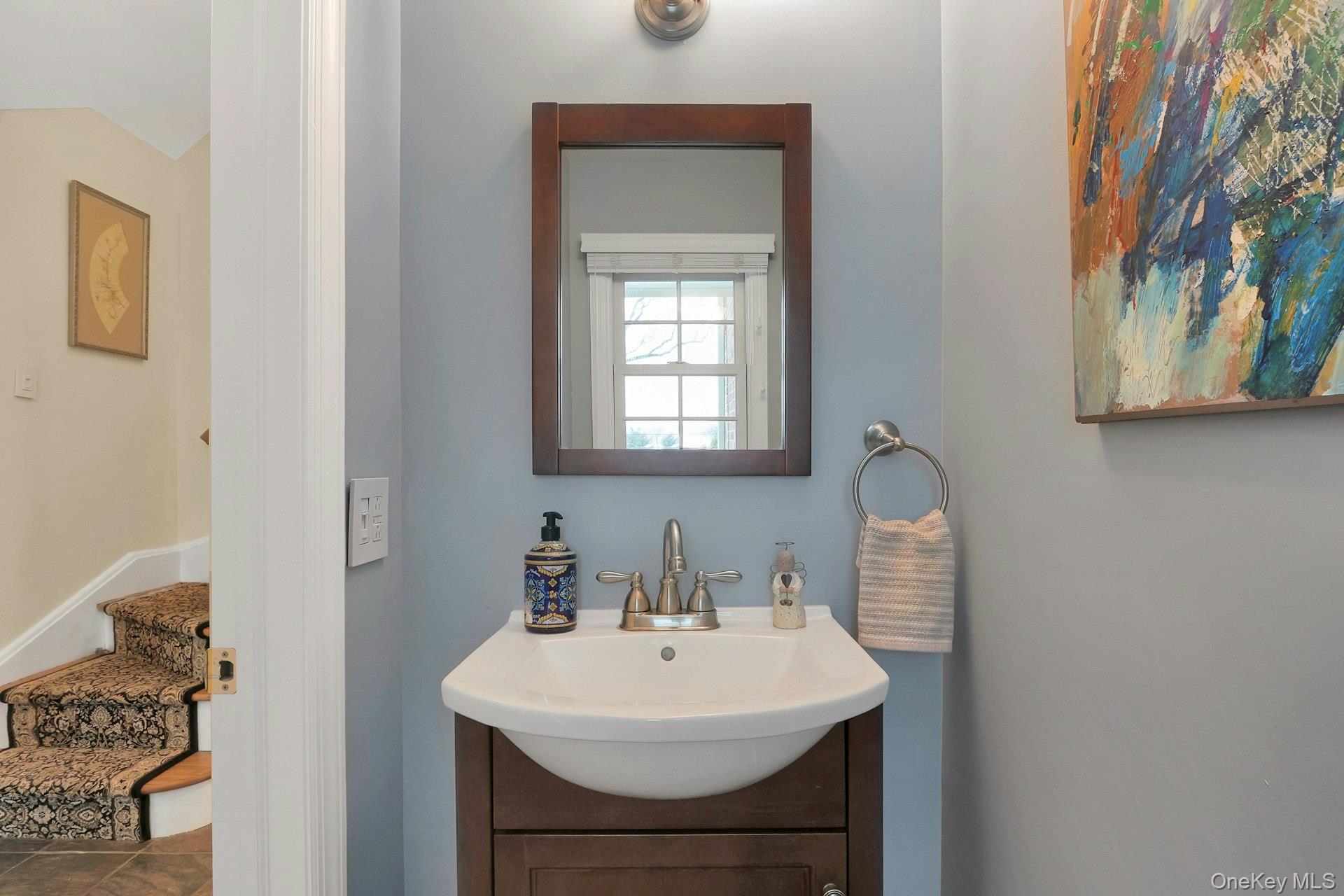 111 Wydendown Road Nyack, NY 10960 - Photo 33 of 46 a bathroom with a sink a mirror and a toilet
