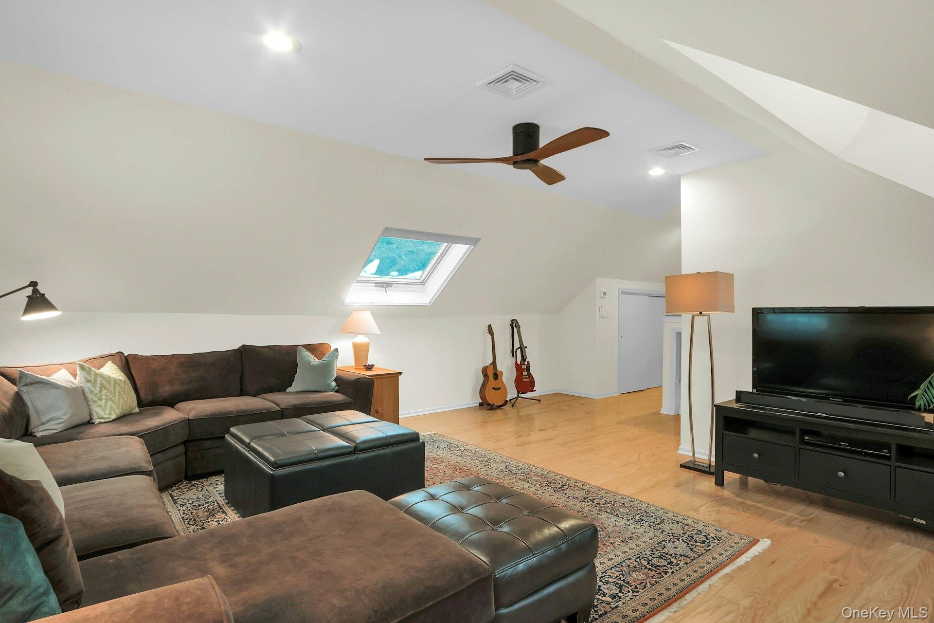 111 Wydendown Road Nyack, NY 10960 - Photo 35 of 46 a living room with furniture and a flat screen tv