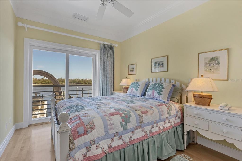 208 Harbor Drive Boca Grande, FL 33921 - Photo 19 of 53 a bedroom with a bed and a dresser