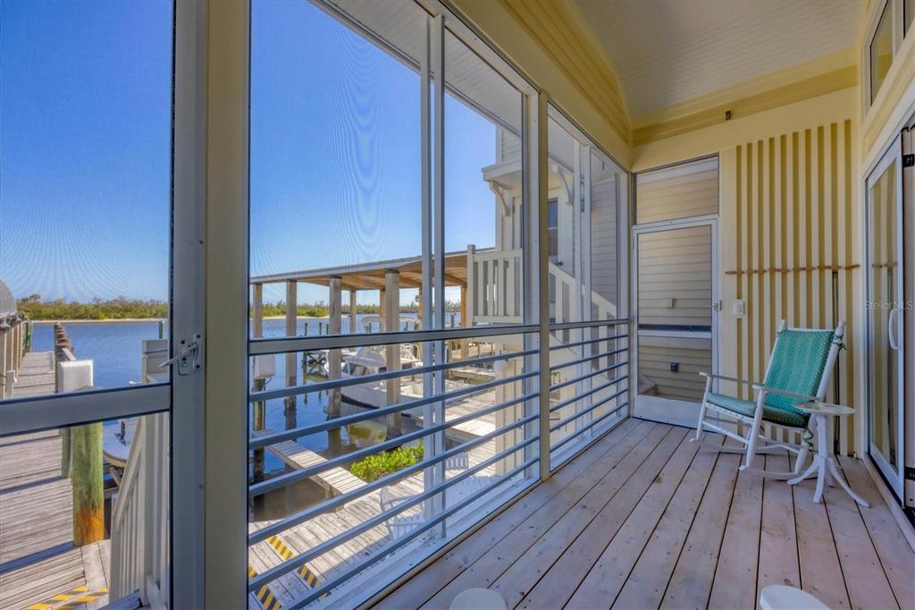 208 Harbor Drive Boca Grande, FL 33921 - Photo 26 of 53 a balcony with wooden floor