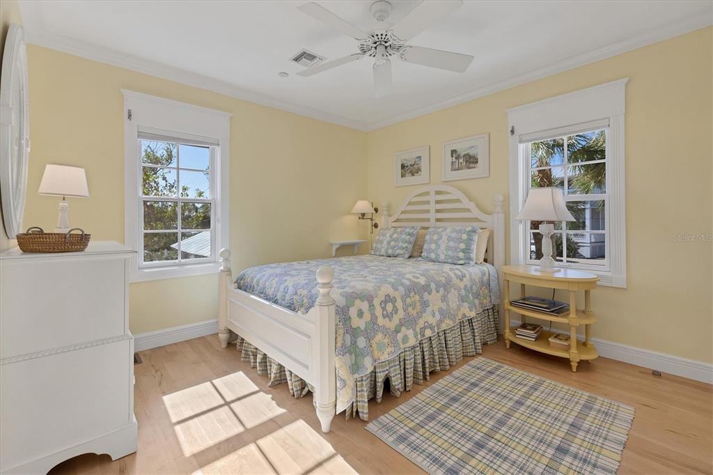 208 Harbor Drive Boca Grande, FL 33921 - Photo 27 of 53 a bedroom with a bed and a window