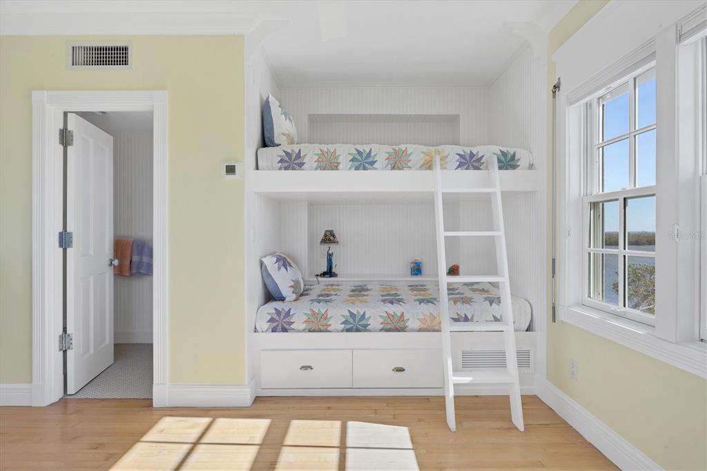 208 Harbor Drive Boca Grande, FL 33921 - Photo 30 of 53 a room with two chairs and mirrors