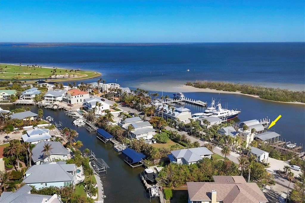 208 Harbor Drive Boca Grande, FL 33921 - Photo 48 of 53 an aerial view of ocean and residential houses with outdoor space