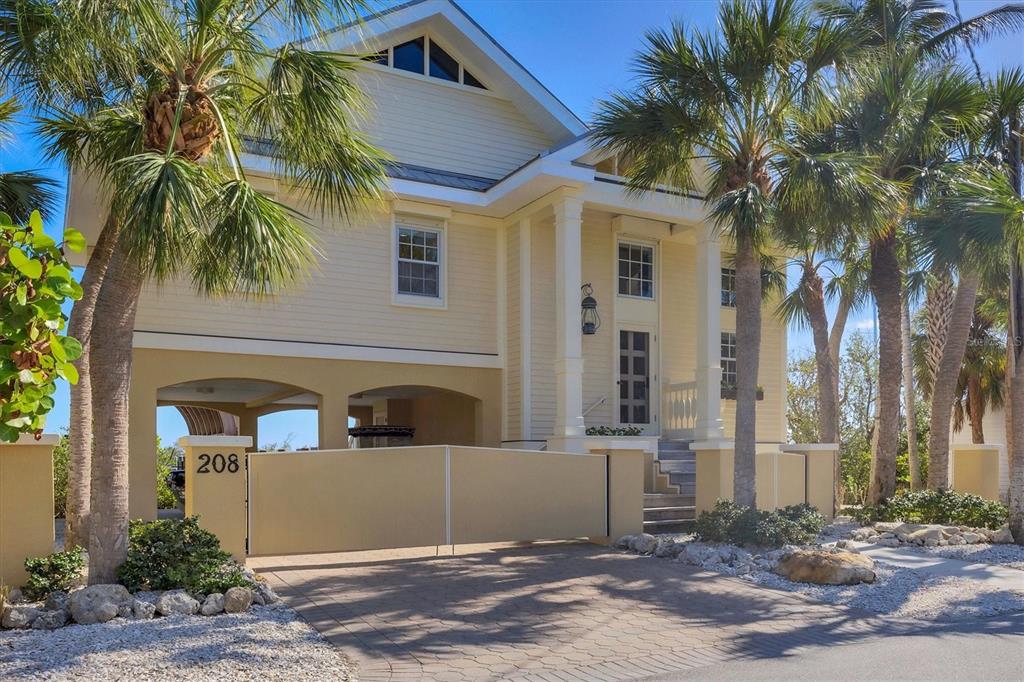 208 Harbor Drive Boca Grande, FL 33921 - Photo 50 of 53 a front view of a house with a yard