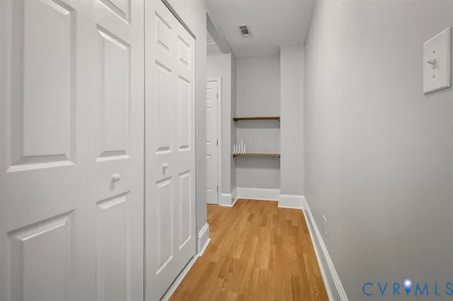 a view of a backyard with a table and chair and wooden fence